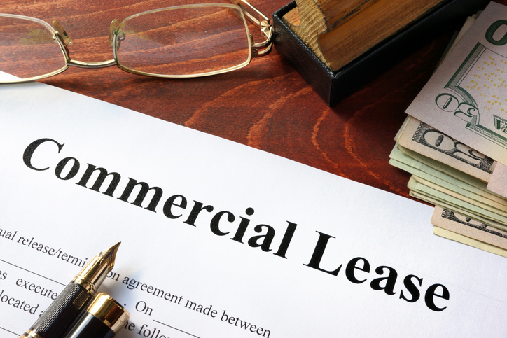 Commercial lease agreement with money on a table